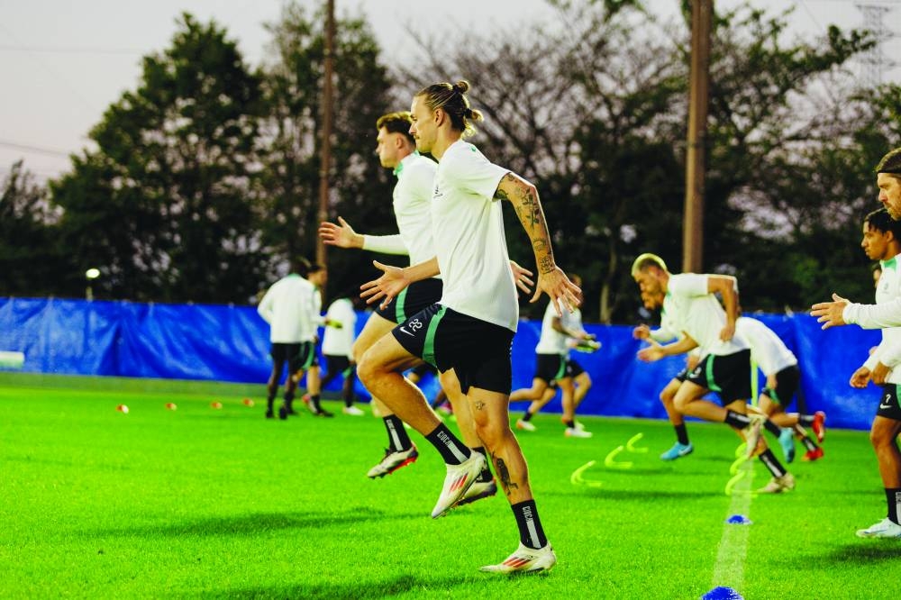 
Australian players train in Saitama, Japan, yesterday, ahead of their World Cup qualifiers. 