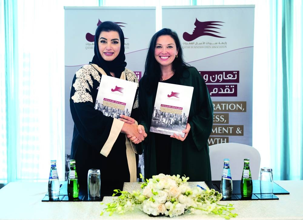 QBWA vice-chairwoman Aisha Alfardan and EWA founder and president Yulia Stark during the signing ceremony.