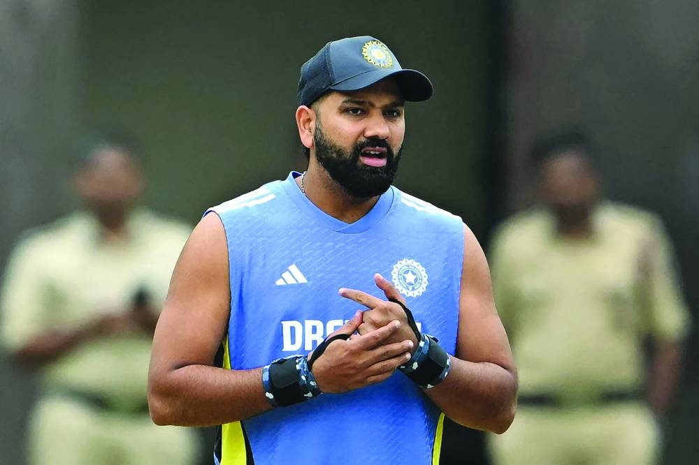 India’s captain Rohit Sharma inspects the field after the first day’s play of the first Test against New Zealand was called-off due to rain at the M Chinnaswamy Stadium in Bengaluru on Wednesday. (AFP)