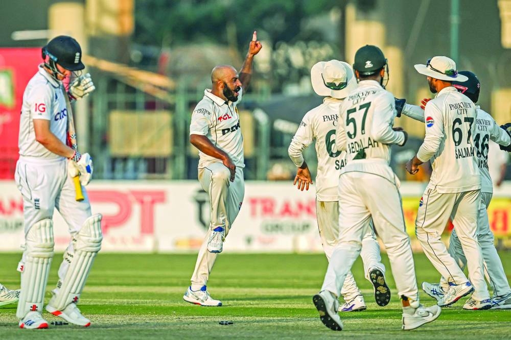 Pakistan’s Sajid Khan (second left) celebrates with teammates after taking the wicket of England’s Harry Brook (left) during the second day of the second Test at the Multan Cricket Stadium on Wednesday. (AFP)