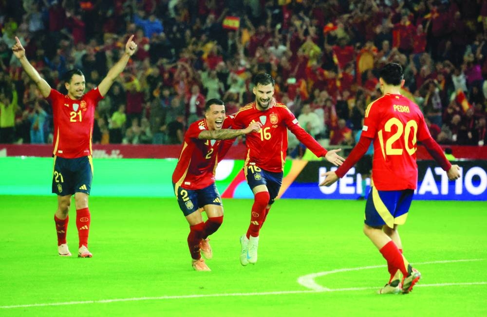 
Spain’s Alex Baena (second right) celebrates with teammates after scoring against Serbia in the UEFA Nations League match in Cordoba, Spain. (Reuters) 