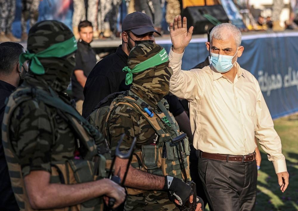 Yahya Sinwar (R), leader of the Palestinian Hamas movement, greets supporters during a rally in Gaza City on May 24, 2021.  File picture: AFP