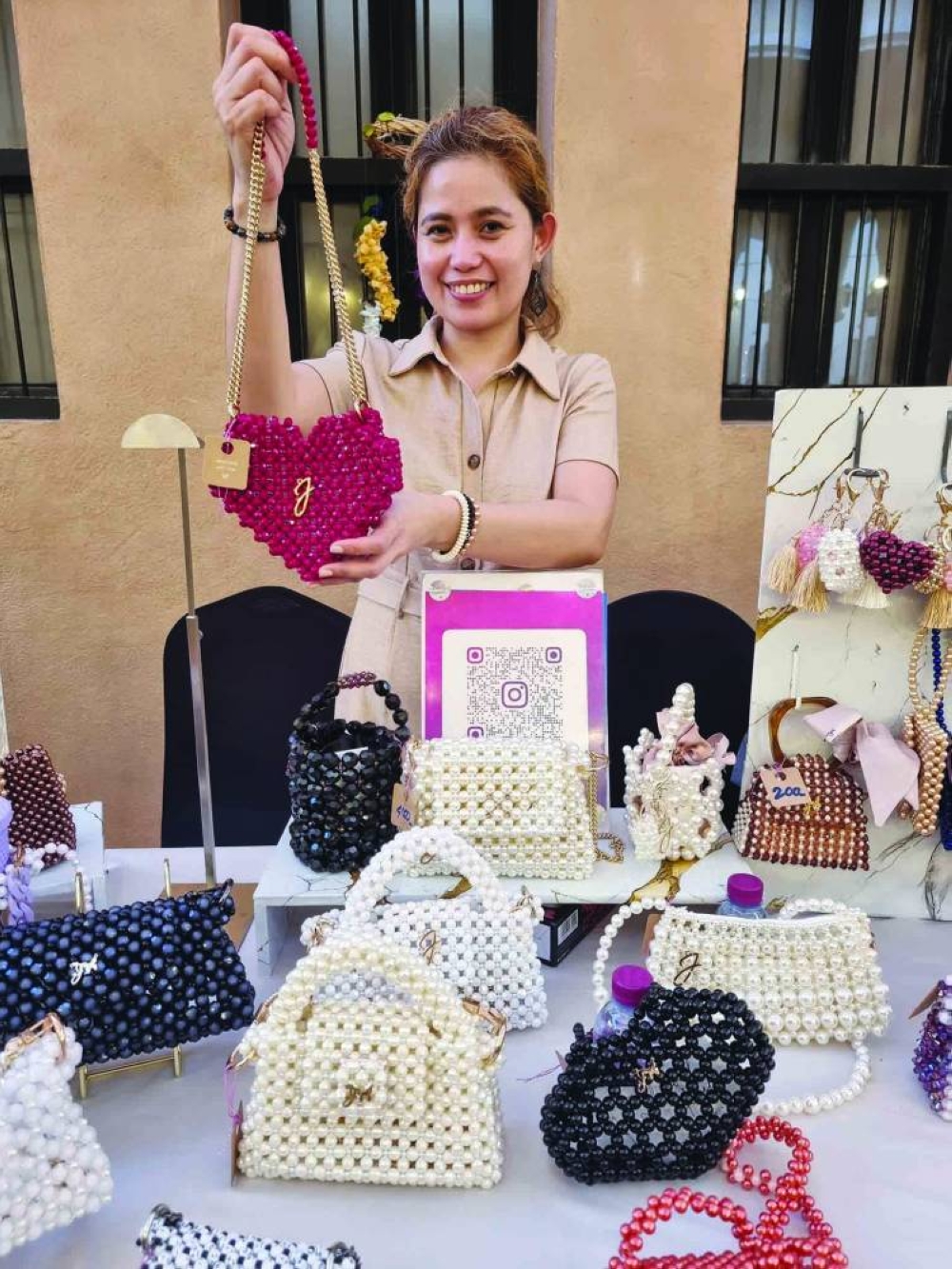 Jamila showcases her items at QatArt Makers Market and Workshop.