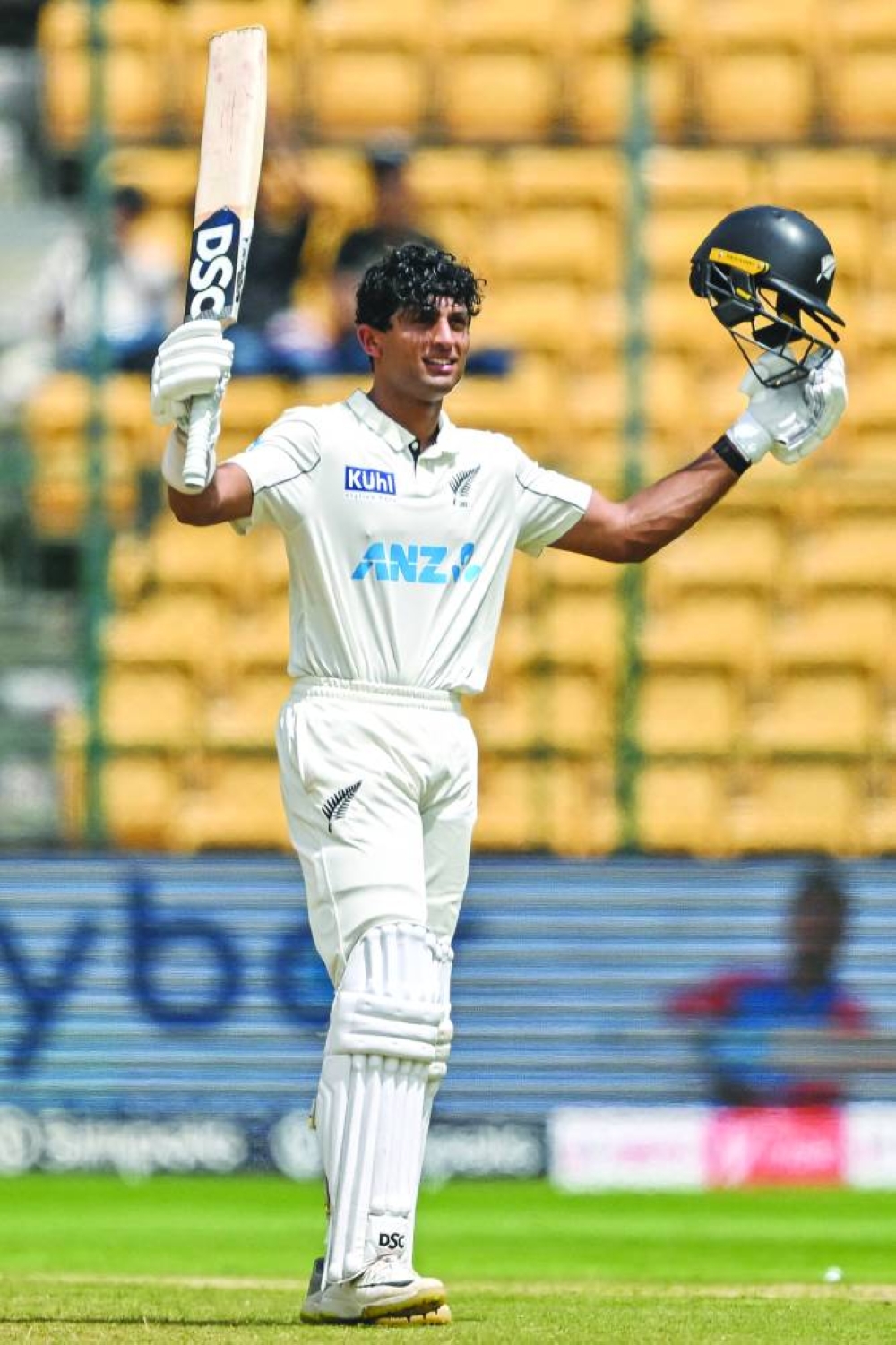 New Zealand’s Rachin Ravindra celebrates after scoring a century during the third day of the first Test against India in Bengaluru on Friday. (AFP)