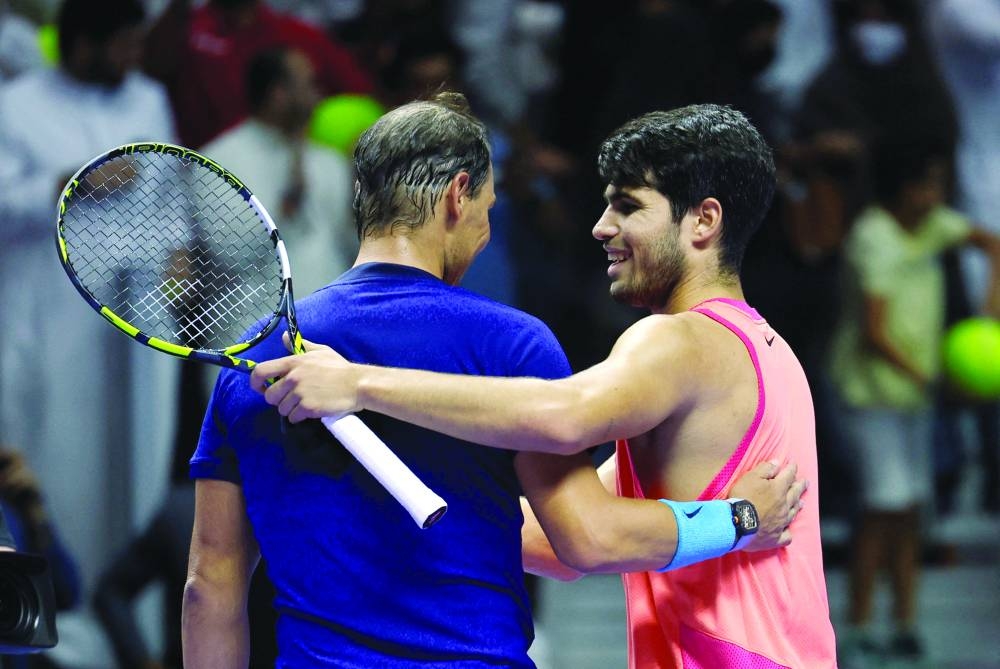 
Spain’s Carlos Alcaraz (right) embraces compatriot Rafael Nadal after winning the semi-final in Riyadh. (Reuters) 