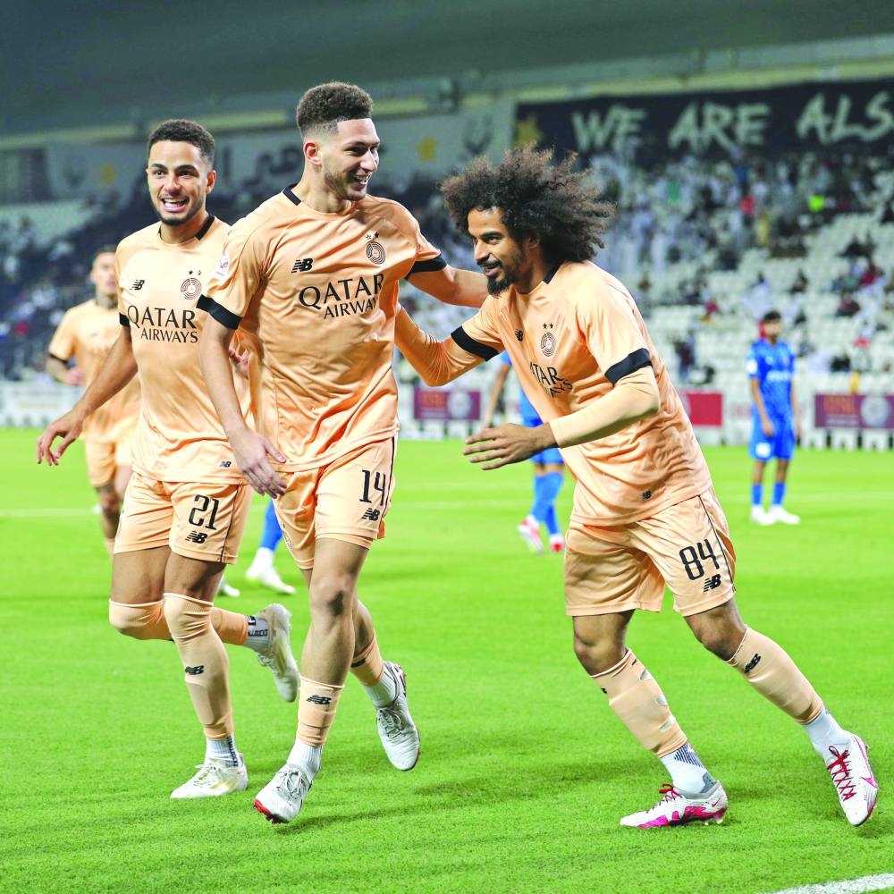 
Al Sadd’s Moustafa Tarek Mashal (centre) celebrates with teammates Akarm Afif (right) and Giovani after scoring against Al Shahania at the Jassim Bin Hamad Stadium. 
