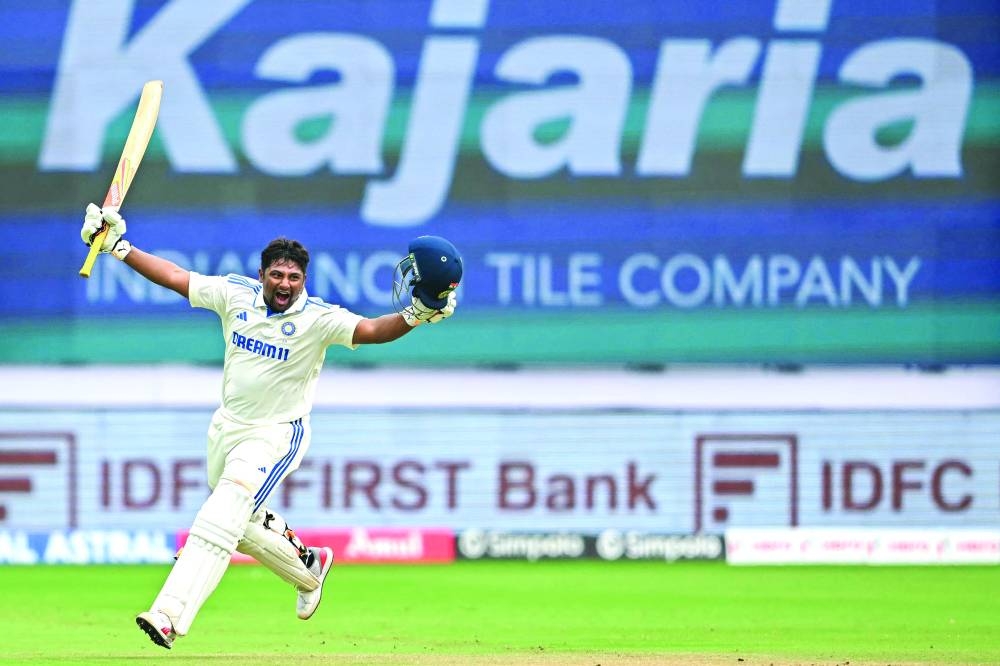 India’s Sarfaraz Khan celebrates after scoring a century in Bengaluru on Saturday. (AFP)