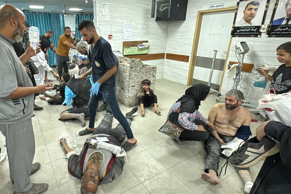 Wounded Palestinians receive treatment at the Kamal Adwan Hospital after an Israeli airstrike in Beit Lahia, in the northern Gaza Strip on Saturday. AFP