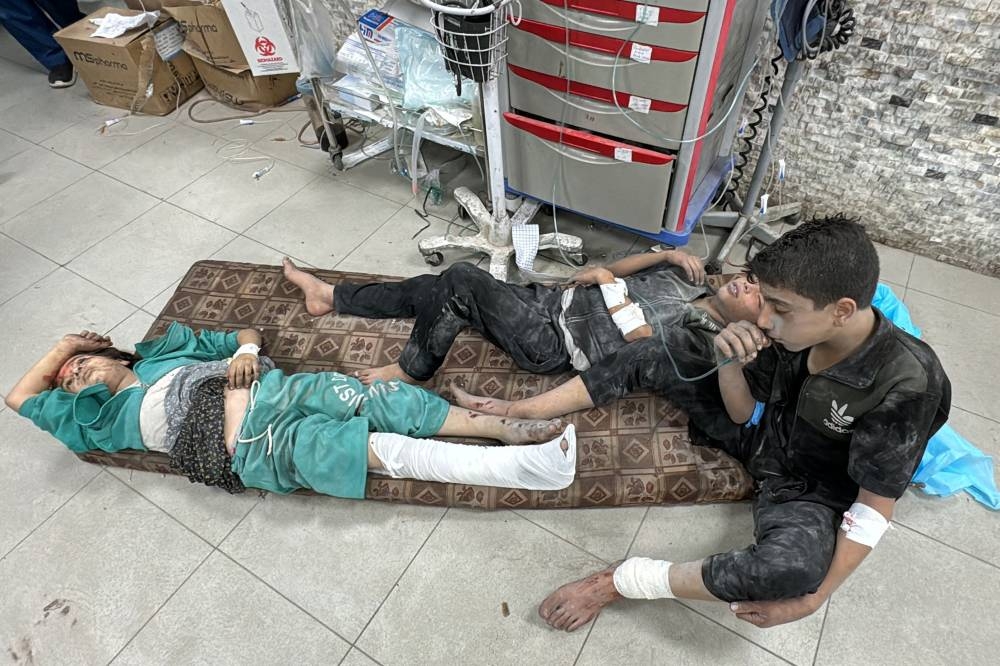 Wounded Palestinians receive treatment at the Kamal Adwan Hospital after an Israeli airstrike in Beit Lahia, in the northern Gaza Strip on Saturday. AFP