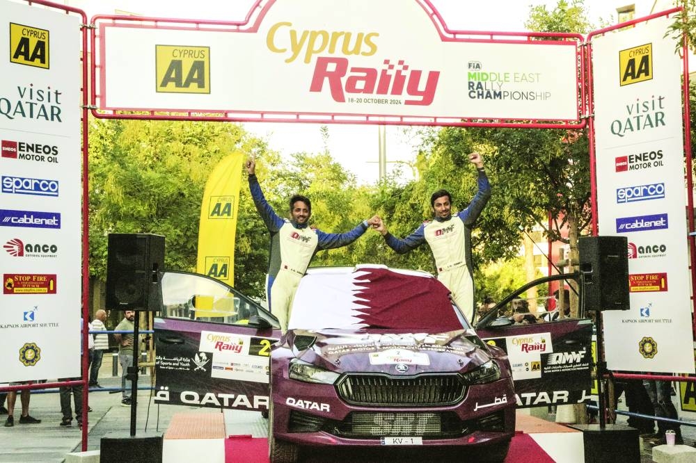 
Abdulaziz al-Kuwari and his co-driver Nasser al-Kuwari celebrate after winning the FIA Middle East Rally Championship at the Cyprus Rally yesterday. 
 