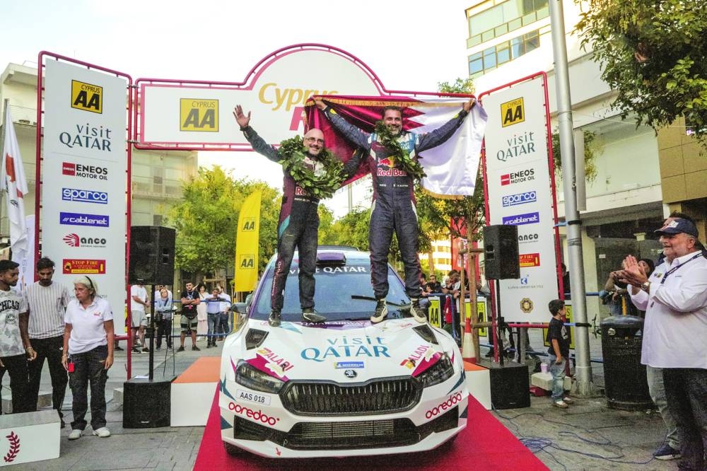 
Qatar’s Nasser al-Attiyah and his Italian co-driver Giovanni Bernacchini celebrate after winning the Cyprus Rally yesterday.
 