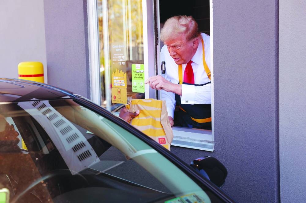 
Right: Trump mans the drive-through line during his visit to a McDonald’s restaurant in Feasterville-Trevose, Pennsylvania. – AFP 