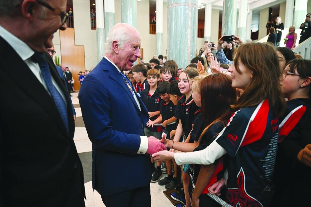 Australian Prime Minister Anthony Albanese and King Charles III meet schoolchildren at the Australian Parliament House in Canberra. – Reuters