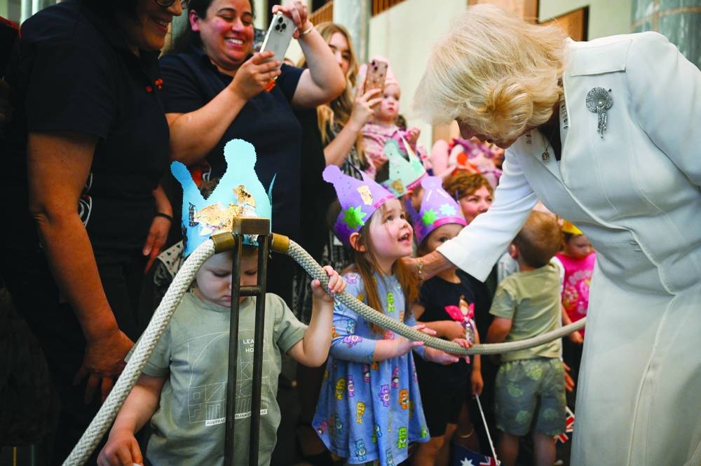 Queen Camilla meets children as she attends the Ceremonial Welcome and Parliamentary Reception at the Australian Parliament House in Canberra. – Reuters