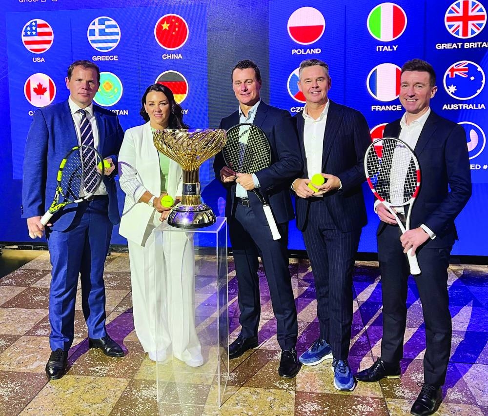 
Tournament Director Stephen Farrow, former tennis player Casey Dellacqua, Australia team captain Lleyton Hewitt, host Todd Woodbridge, and Sydney General Manager Paul Daly pose with the trophy at the draw for the United Cup in Sydney, Australia. (Reuters) 