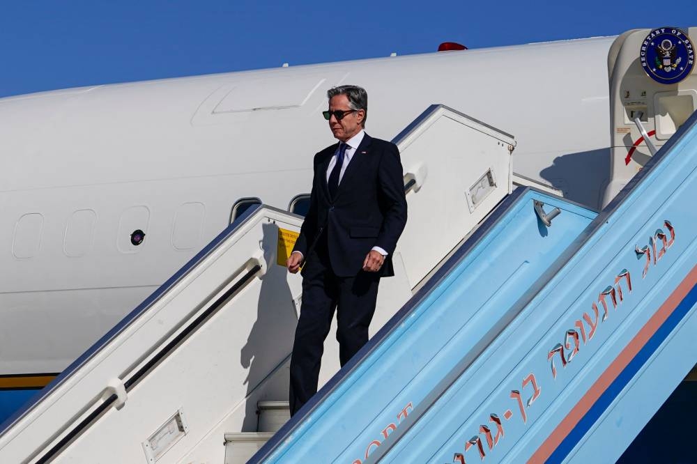 US Secretary of State Antony Blinken disembarks from his plane upon arrival at the Ben Gurion Airport in Tel Aviv on Tuesday. AFP
