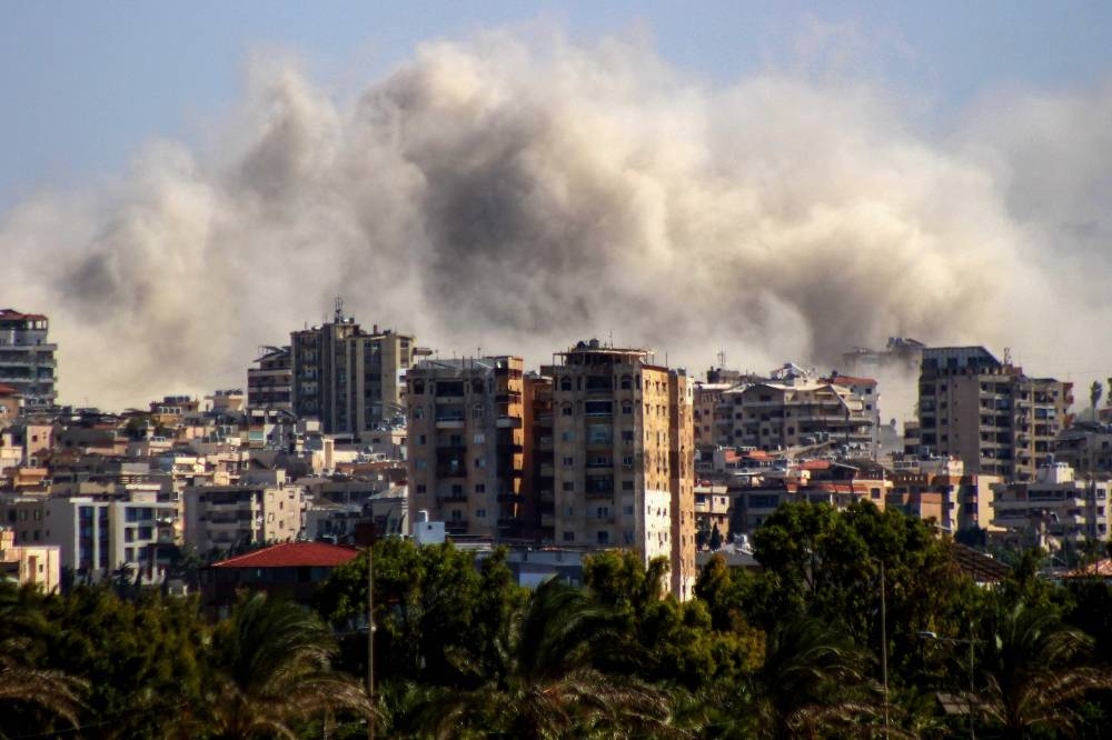 Smoke as it rises from the site of an Israeli airstrike that targeted Al-Hawsh village on the outskirsts of the city of Tyre on Wednesday. AFP