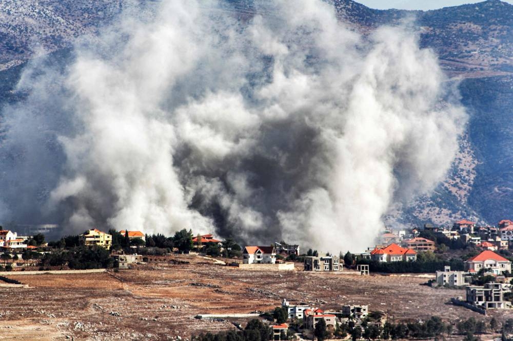 Smoke rises following an Israeli air strike on the village of Khiam in southern Lebanon near the border with Israel on Wednesday. AFP