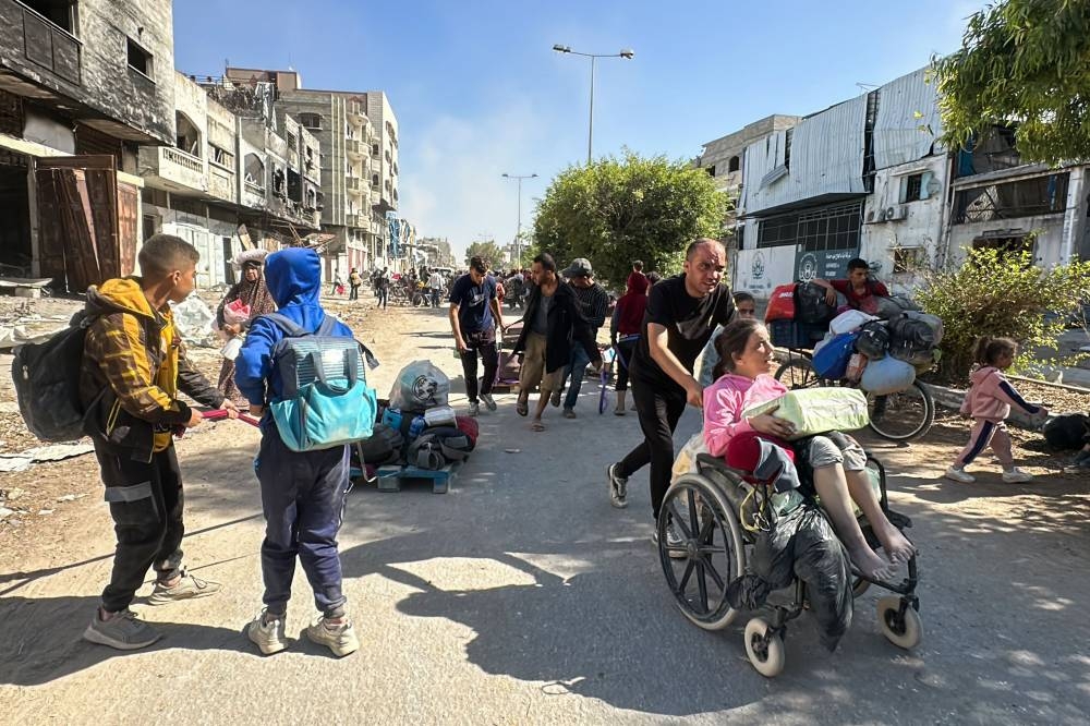 Displaced families fleeing Israeli army operations in Jabalia in northern Gaza take the main Salah al-Din road towards Gaza City on Wednesday. AFP