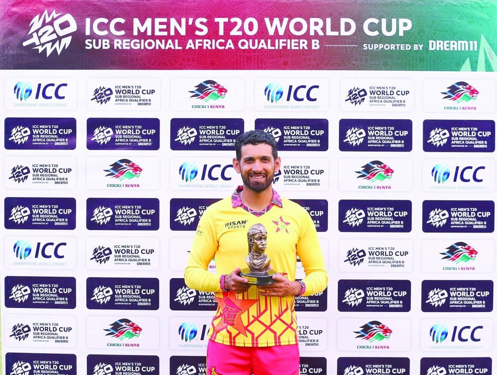 Sikandar Raza of Zimbabawe holds the Man of the Match trophy after his beat Gambia