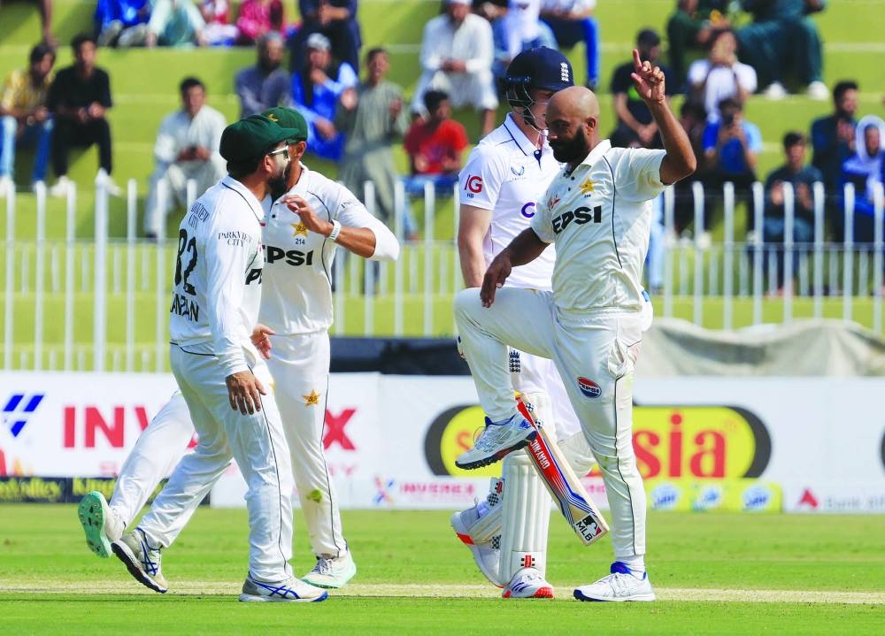Pakistan's Sajid Khan celebrates after taking the wicket of England's Harry Brook during the first day of the third and final Test at Rawalpindi Cricket Stadium yesterday. (Reuters)