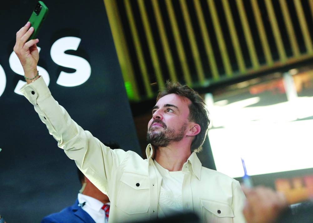 Aston Martin’s Fernando Alonso takes a selfie during his 400th Grand Prix press conference ahead of the Mexico City Grand Prix. (Reuters)