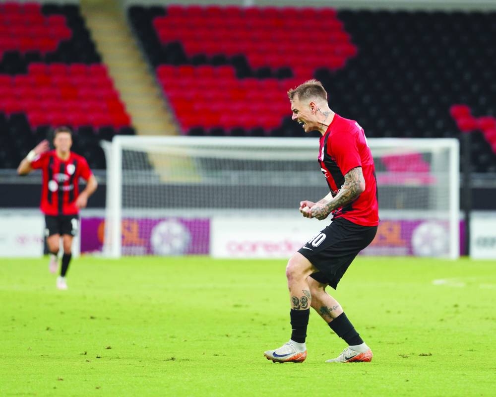 Al Rayyan's Roger Guedes celebrates after scoring against Al Ahli in the Qatar Stars League at the Ahmad Bin Ali Stadium on Saturday.
