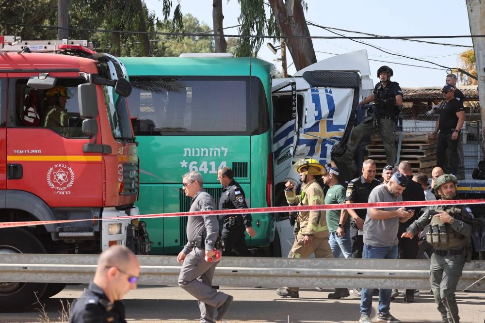 Israeli police secure the site of a ramming attack in Ramat Hasharon, north of Tel Aviv on Sunday. AFP