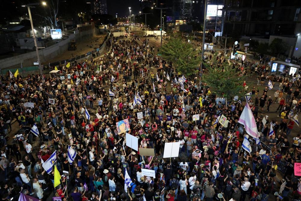 People protest against Israel's government and demand a ceasefire deal and the immediate release of hostages in Tel Aviv, Israel, Saturday. REUTERS