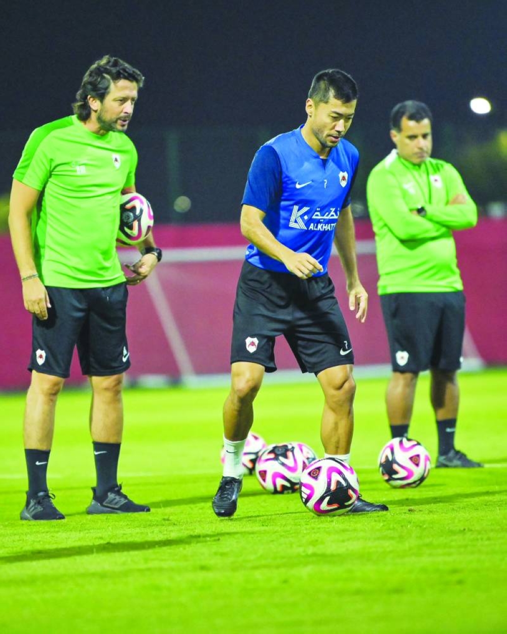 
Al Rayyan’s Rodrigo Tabata trains under the watchful eyes of coach Younes Ali (right). 