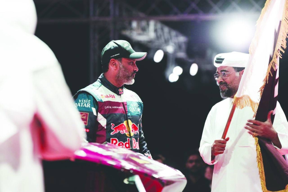 
Qatar Motor & Motorcycle Federation President Abdulrahman al-Mannai with Nasser Saleh al-Attiyah at the start of the Qatar International Baja at Katara Cultural Village. 