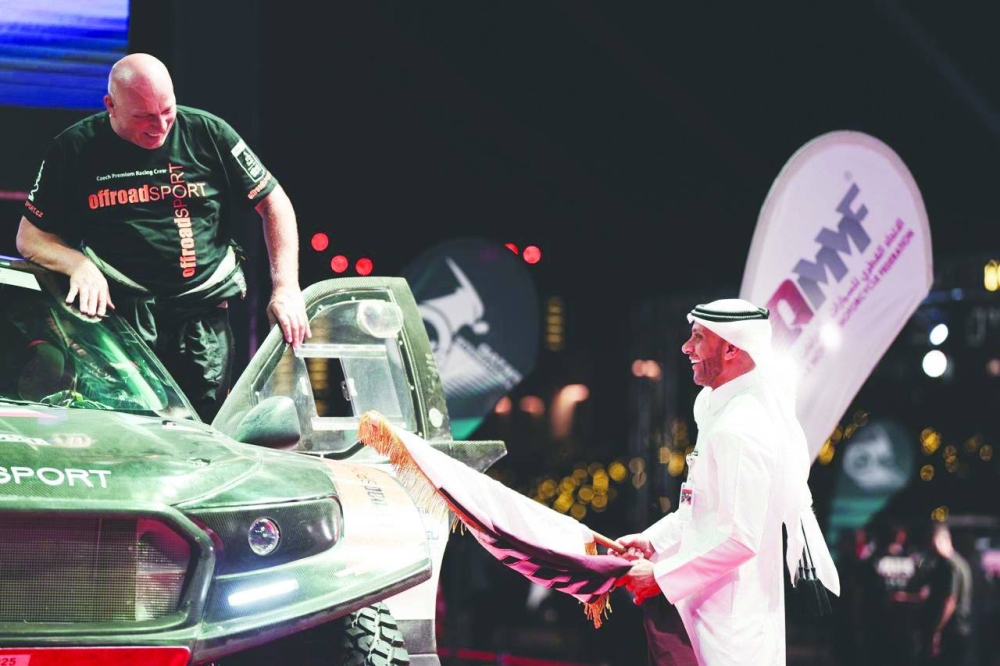 QMMF’s Executive Director Amro al-Hamad flags away Miroslav Zapletal.