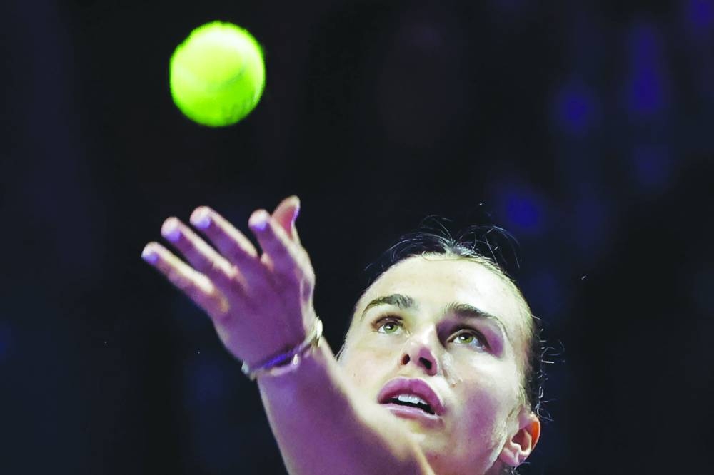 
Belarus’ Aryna Sabalenka serves against China’s Zheng Qinwen during their WTA Finals match in Riyadh yesterday. (AFP) 