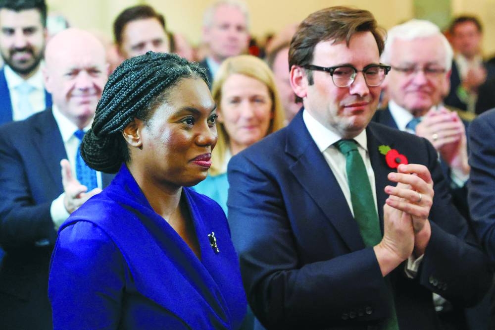 Hamish Badenoch, husband of Kemi Badenoch, applauds her on the day she was announced as the new leader of Britain’s Conservative Party, in London.