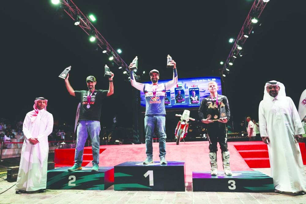 Motorcycle winners with the QMMF president Abdrulrahman al-Mannai and Executive Director Amro al-Hamad during the podium ceremony of the Qatar International Baja at the Katara – the Cultural Village amphitheatre.