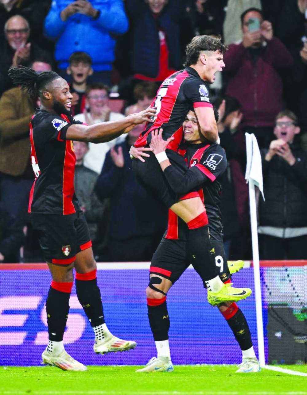 
AFC Bournemouth’s Evanilson celebrates with teammates after scoring their second goal against Manchester City yesterday. (Reuters) 