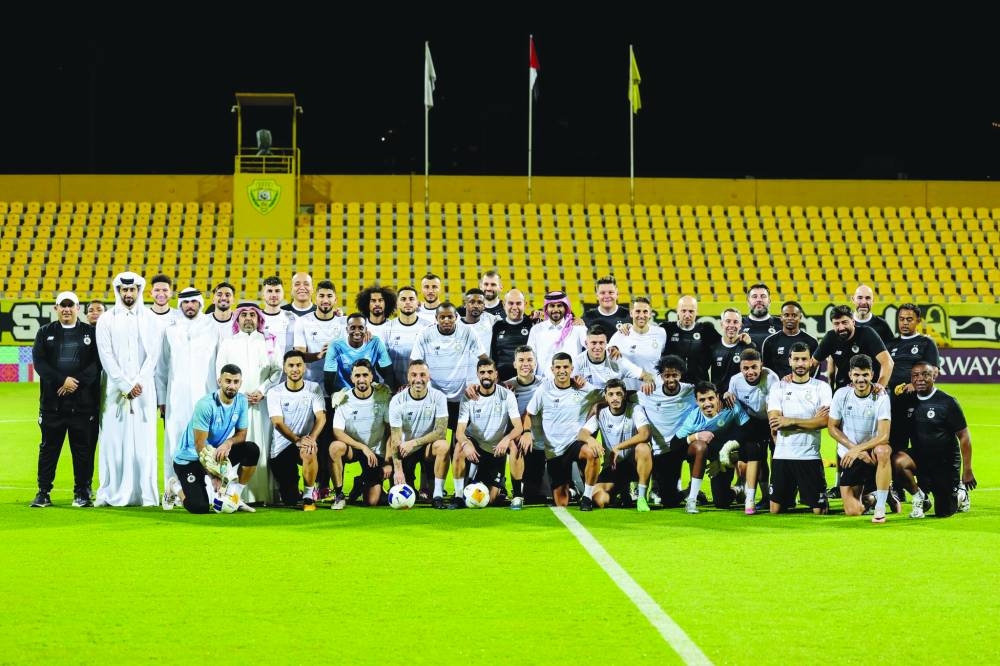 
Al Sadd players and club officials pose for a group photograph at Al Zabeel Stadium in Dubai yesterday. Qatar football giants Al Sadd take on hosts Al Wasl of the UAE in an AFC Champions League Elite clash today at 5pm Doha time. (@AlsaddSC) 