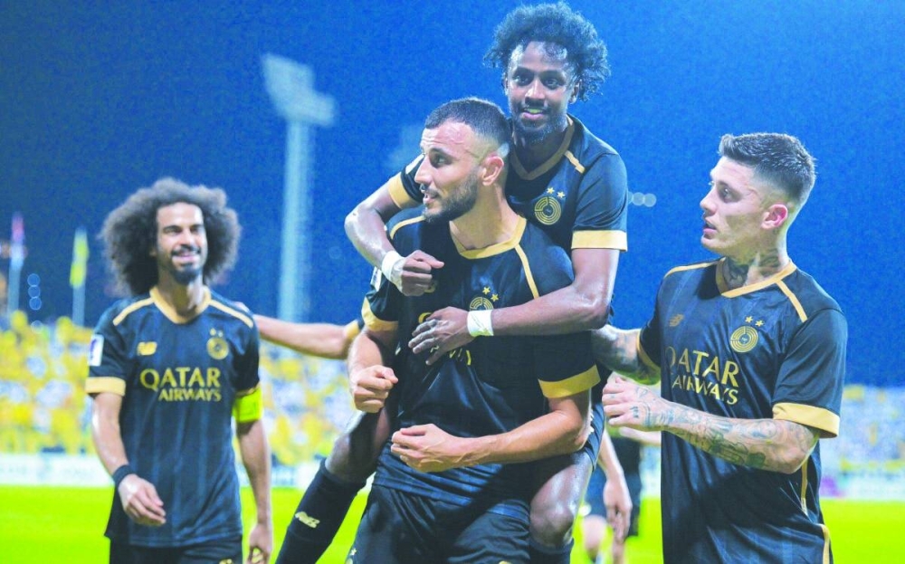 Al Sadd’s Romain Saiss celebrates with teammates after scoring against Al Wasl at the Zabeel Stadium in Dubai yesterday.