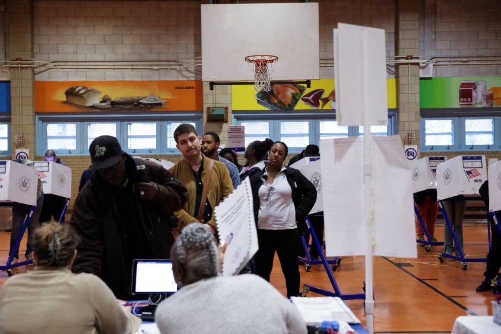 People vote in the 2024 US presidential election on Election Day in New York City, New York, on Tuesday. REUTERS
