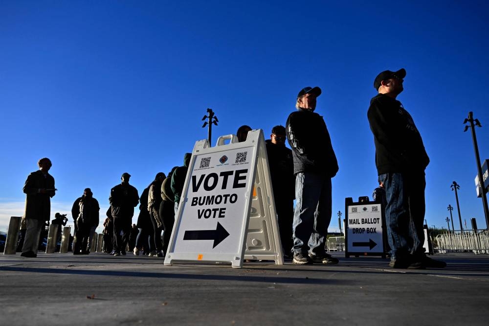 Voters line up to cast their ballots at Allegiant Stadium on Tuesday in Las Vegas, Nevada. AFP