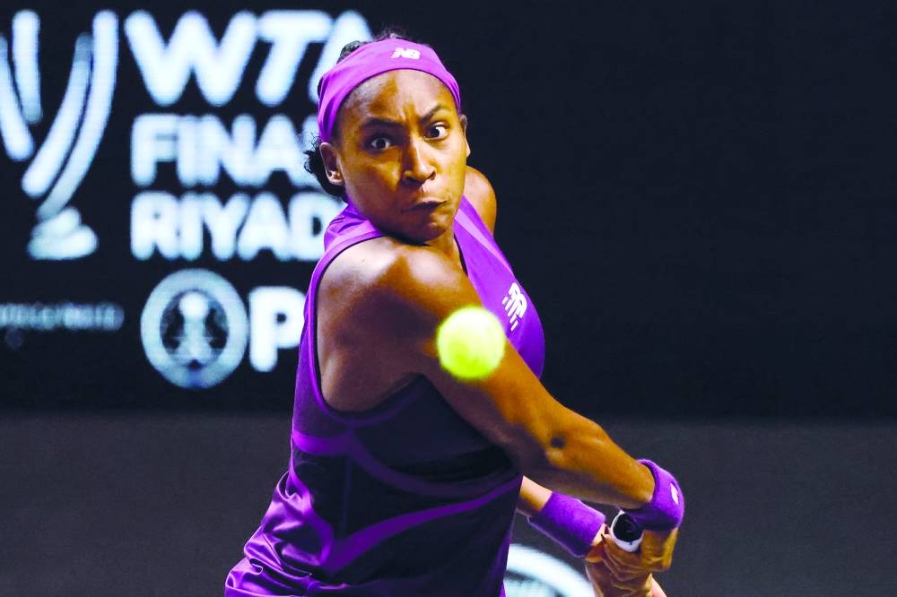 Coco Gauff returns the ball to Iga Swiatek during their WTA Finals Championship match in Riyadh yesterday. (AFP)