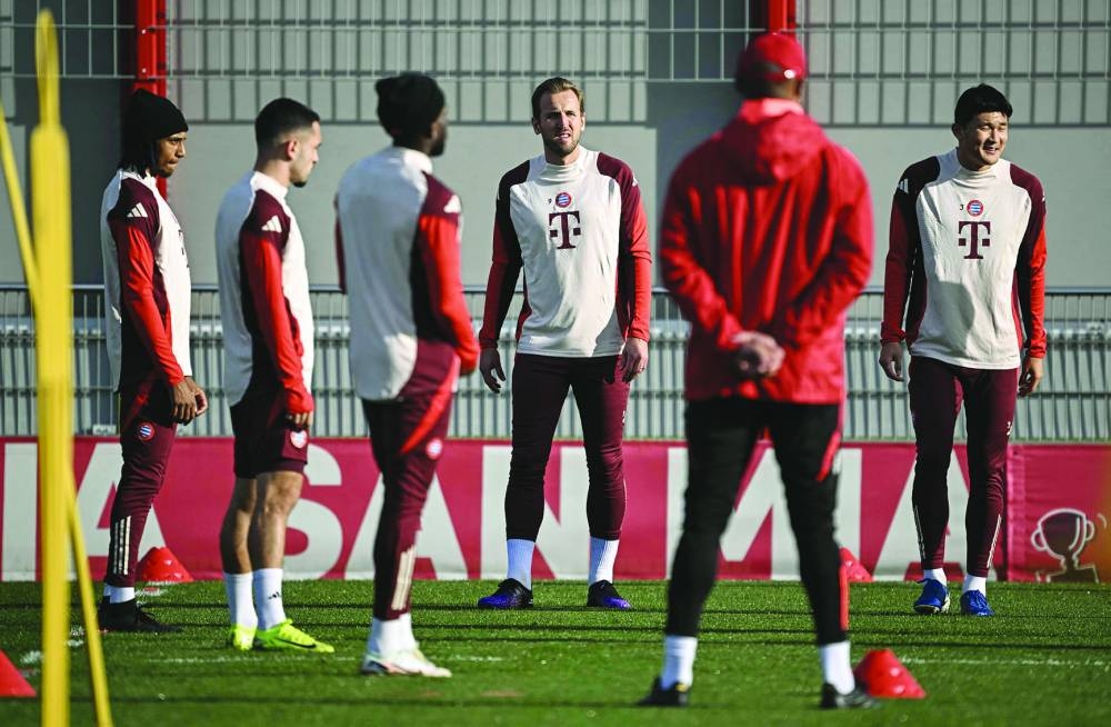 
Bayern Munich’s Michael Olise (left), Harry Kane  (fourth from left) and Kim Min-Jae (right) listen to coach Vincent Kompany during a training session yesterday. (AFP) 