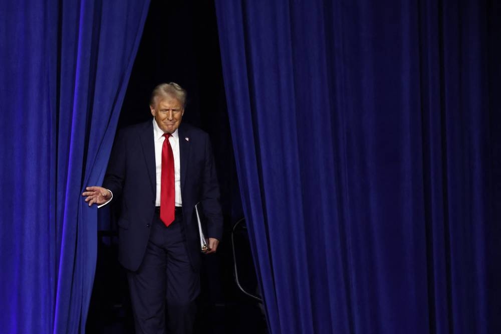 Republican presidential nominee, former U.S. President Donald Trump arrives to speak during an election night event at the Palm Beach Convention Center Wednesday.