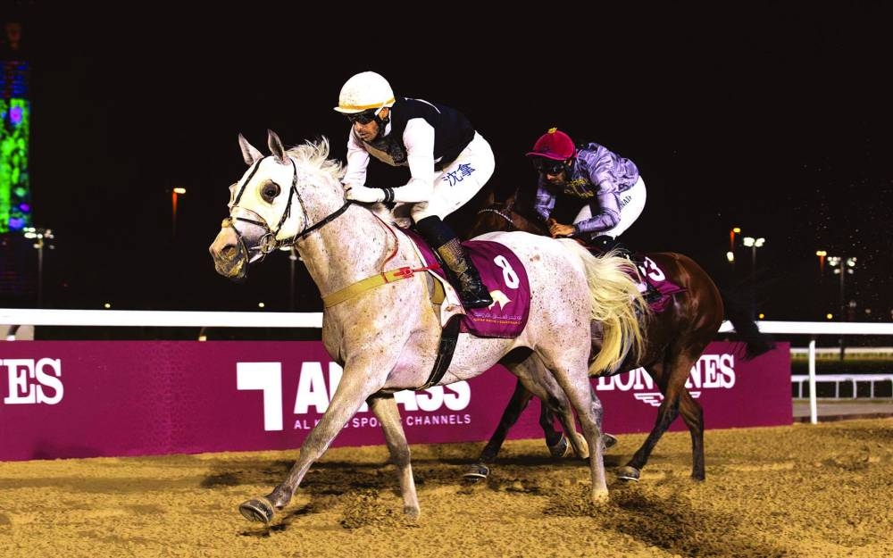 
Jockey Alberto Sanna guides Mared Al Jasra to the Al Beshariyah Cup win yesterday. 