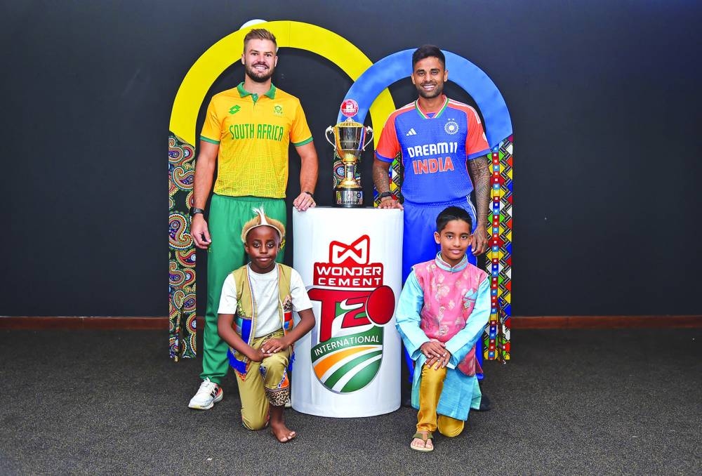 
South Africa captain Aiden Markram and his Indian counterpart Suryakumar Yadav (right) pose with the trophy yesterday, on the eve of first match of the four-match T20I series.
 