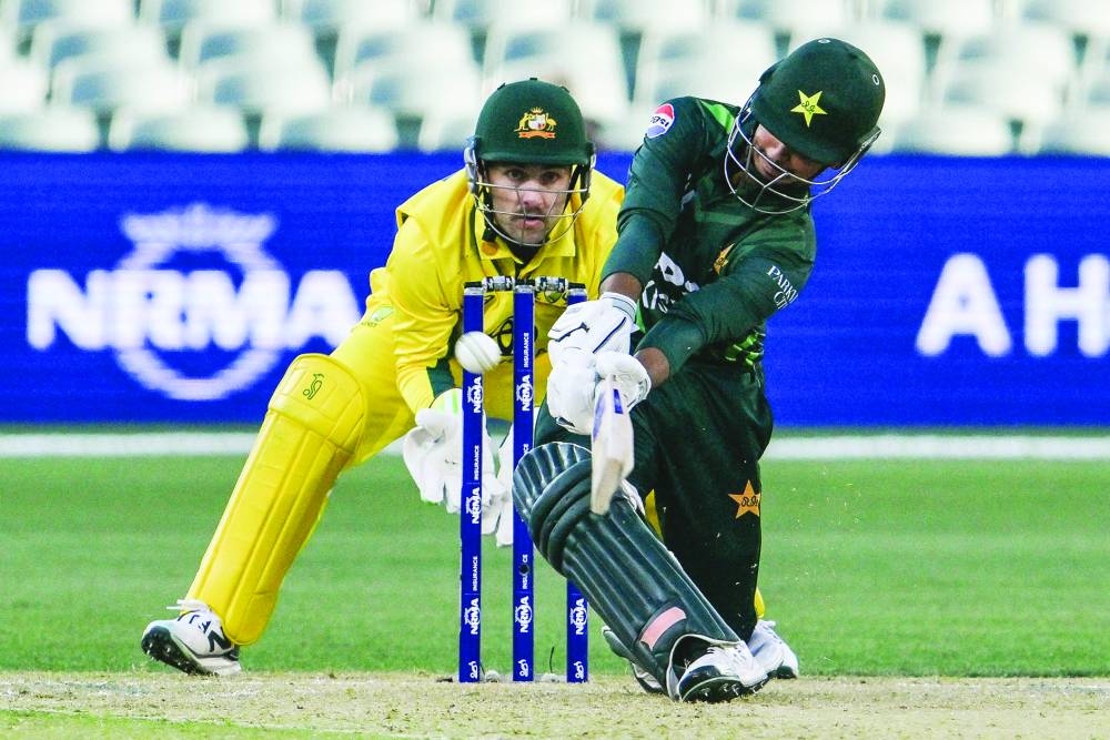 Pakistan’s Saim Ayub hits a four as Australia’s wicket-keeper Josh Inglis looks on during the second ODI at Adelaide Oval yesterday. (AFP)
