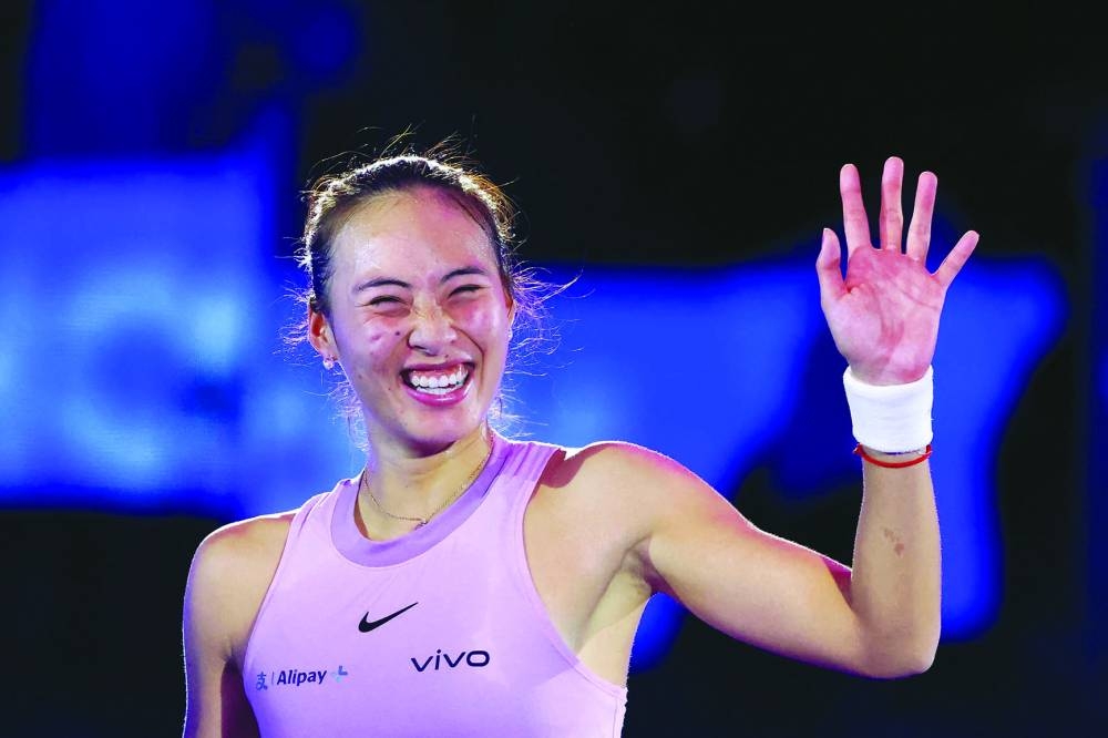 China’s Zheng Qinwen is all smiles after winning against Czech Republic’s Barbora Krejcikova in the semi-finals of the WTA Finals Championship in Riyadh yesterday. (AFP)