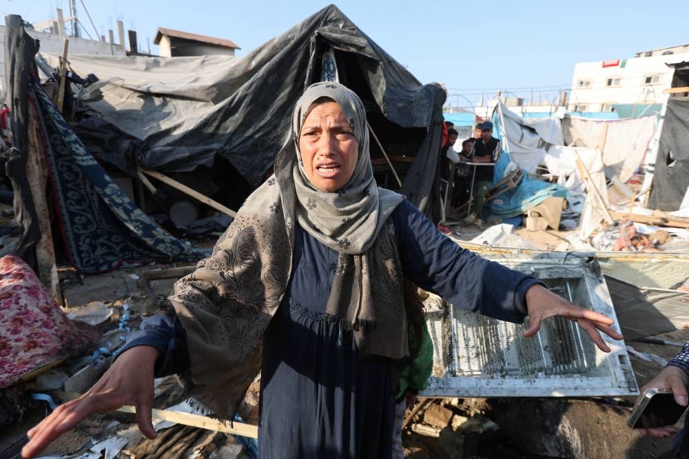 A woman reacts at the site of an Israeli strike on a tent housing displaced people, at Al-Aqsa Martyrs Hospital in Deir Al-Balah, in the central Gaza Strip, on Saturday. REUTERS