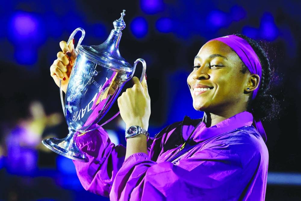US’ Coco Gauff celebrates with trophy after winning the WTA Finals Championship in Riyadh yesterday. (AFP)