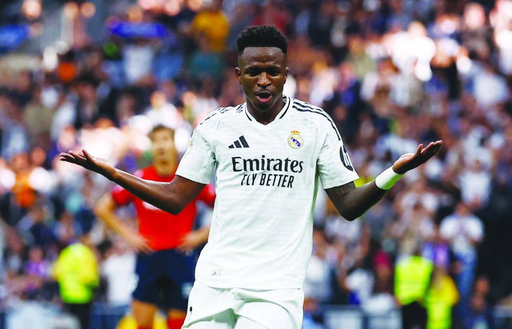 Real Madrid’s Vinicius Junior celebrates after completing his hat-trick against Osasuna at the Santiago Bernabeu in Madrid. (Reuters)